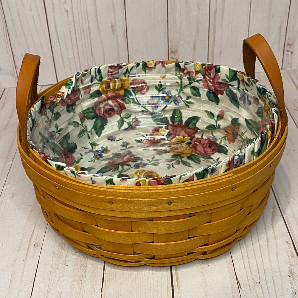 Longaberger Circular Basket with Floral Lining and plastic insert like new